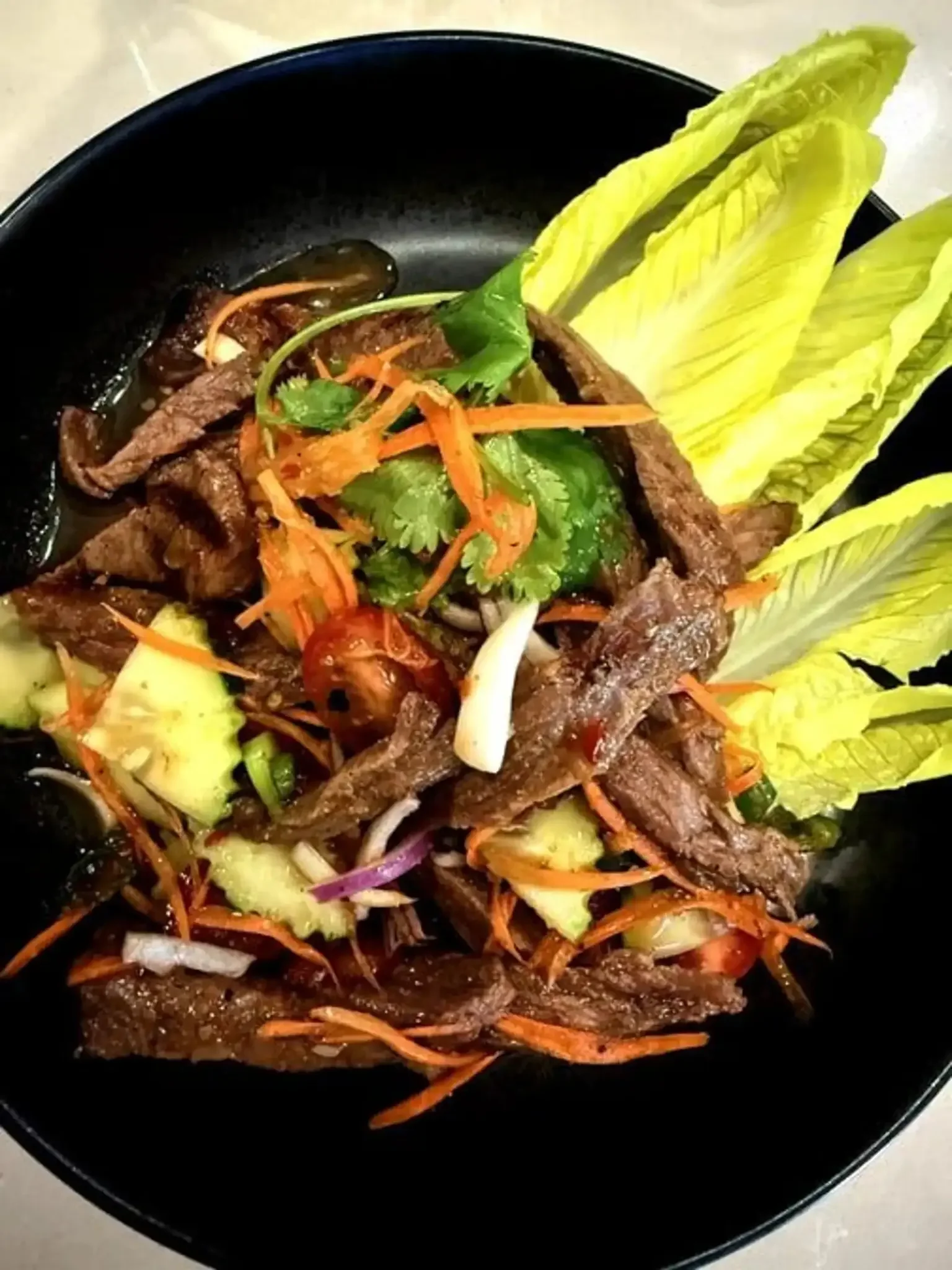 Beef Salad (Yum Nua) - Spicy Thai beef salad with lime and herbs