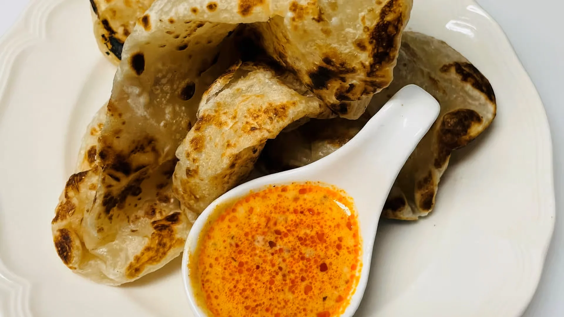 Roti with Curry Sauce - Flaky roti bread with rich curry dipping sauce